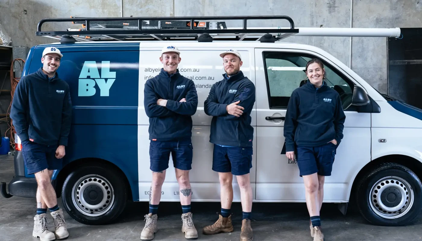 Alby Electrical & Air team posing with service van, offering electrical services in Perth.